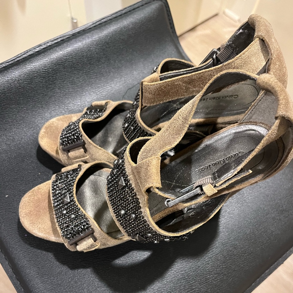 Calvin Klein Olive distressed heels with gunmetal hardware.